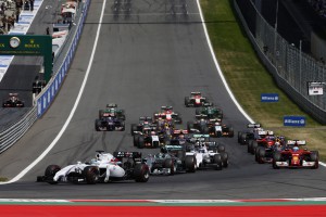 Red Bull Ring, Spielberg, Austria. Sunday 22 June 2014. Felipe Massa, Williams FW36 Mercedes, leads Nico Rosberg, Mercedes F1 W05 Hybrid, Valterri Bottas, Williams FW36 Mercedes, Fernando Alonso, Ferrari F14T, and the rest of the field at the start. World Copyright: Glenn Dunbar/LAT Photographic. ref: Digital Image _W2Q1674